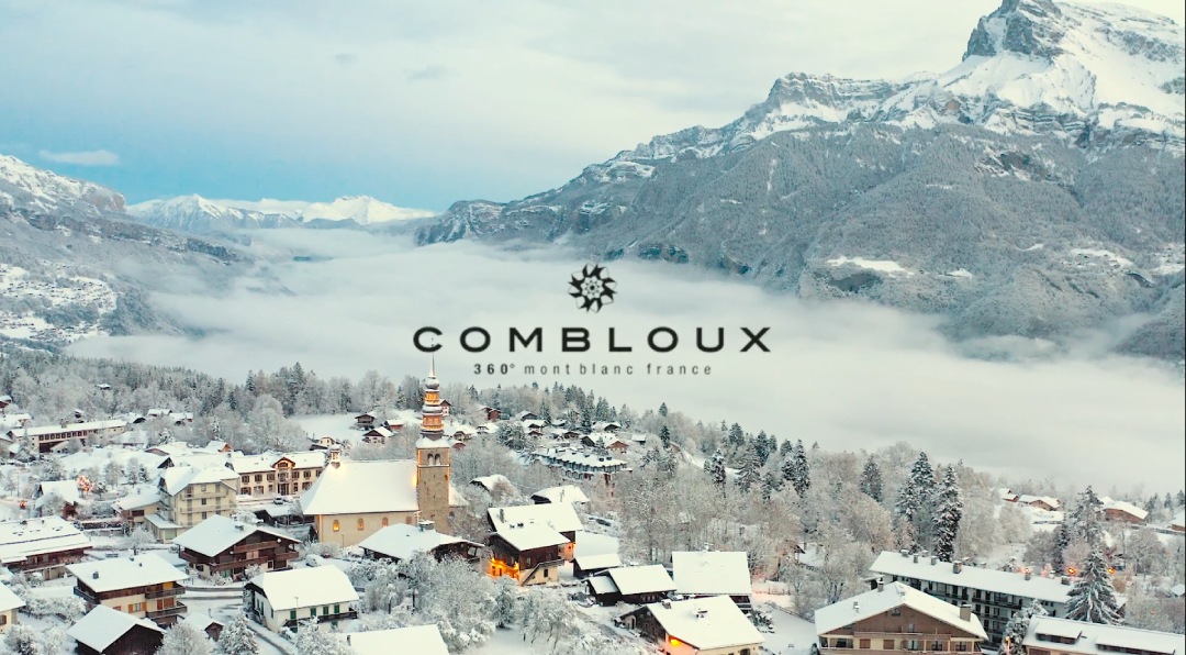 aerial view village combloux snowy chalet mountain fiz lettering logo combloux