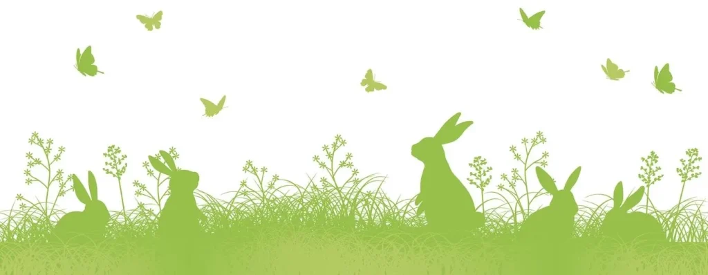 siluetas de conejitos de Pascua en un campo de hierba