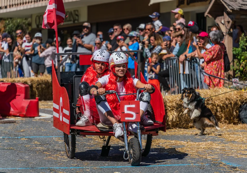 photo red craft cart two girls red wigs on board