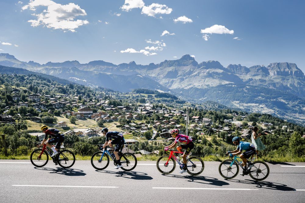 4 cyclists in a row combloux aravis road
