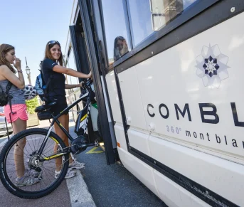 young woman boarding the Combloux station shuttle with her bike