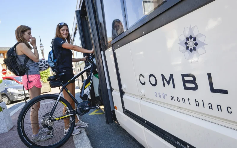 young woman boarding the Combloux station shuttle with her bike