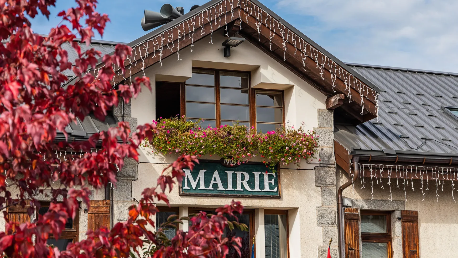 Facade of Combloux town hall in autumn