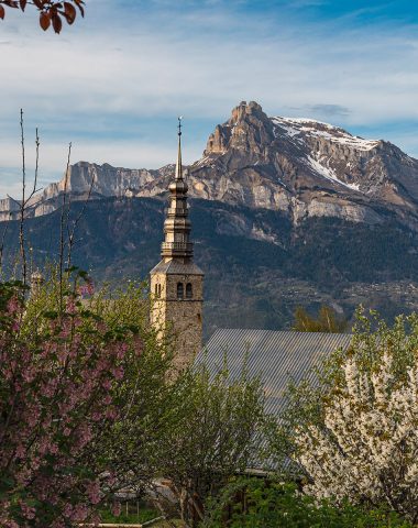 Bell tower of the Church of Combloux in spring