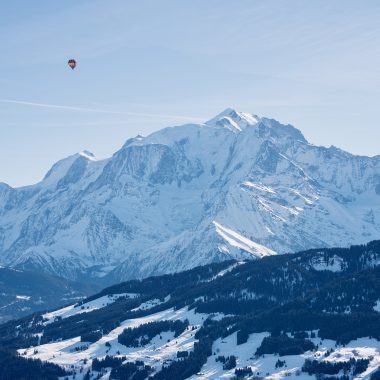 Hot air balloon flying in front of Mont Blanc