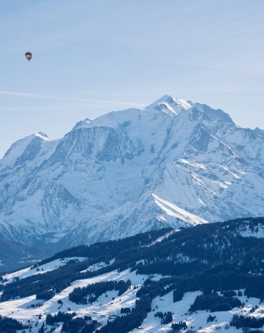Hot air balloon flying in front of Mont Blanc