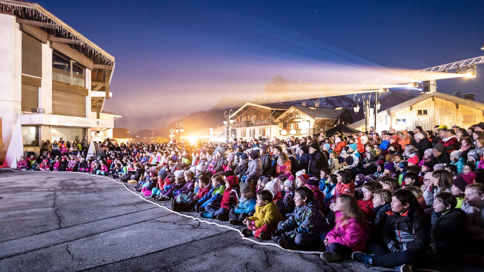 lit crowd in front of scene legende combloux forecourt tourist office combloux