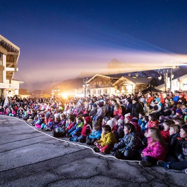 lit crowd in front of scene legende combloux forecourt tourist office combloux