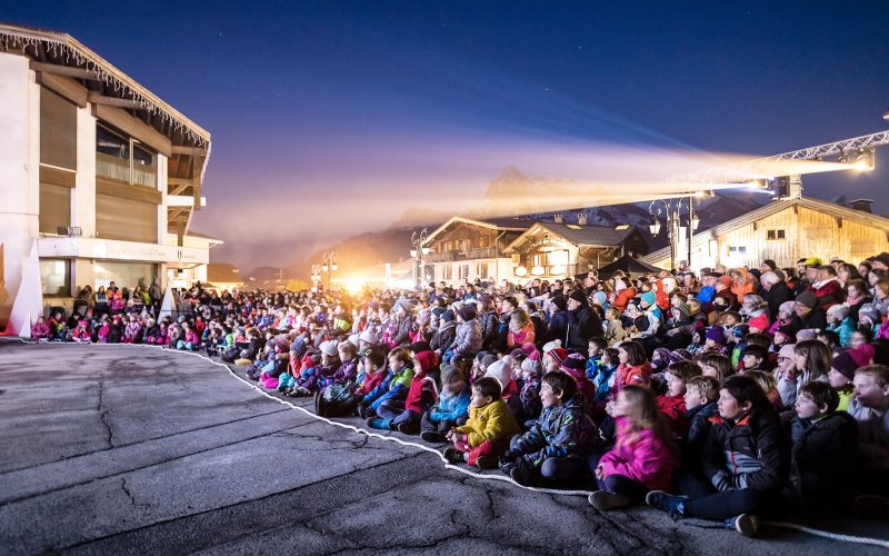 lit crowd in front of scene legende combloux forecourt tourist office combloux